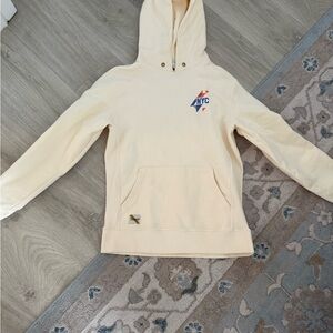 Tracksmith Cream Hoodie with NYC Logo